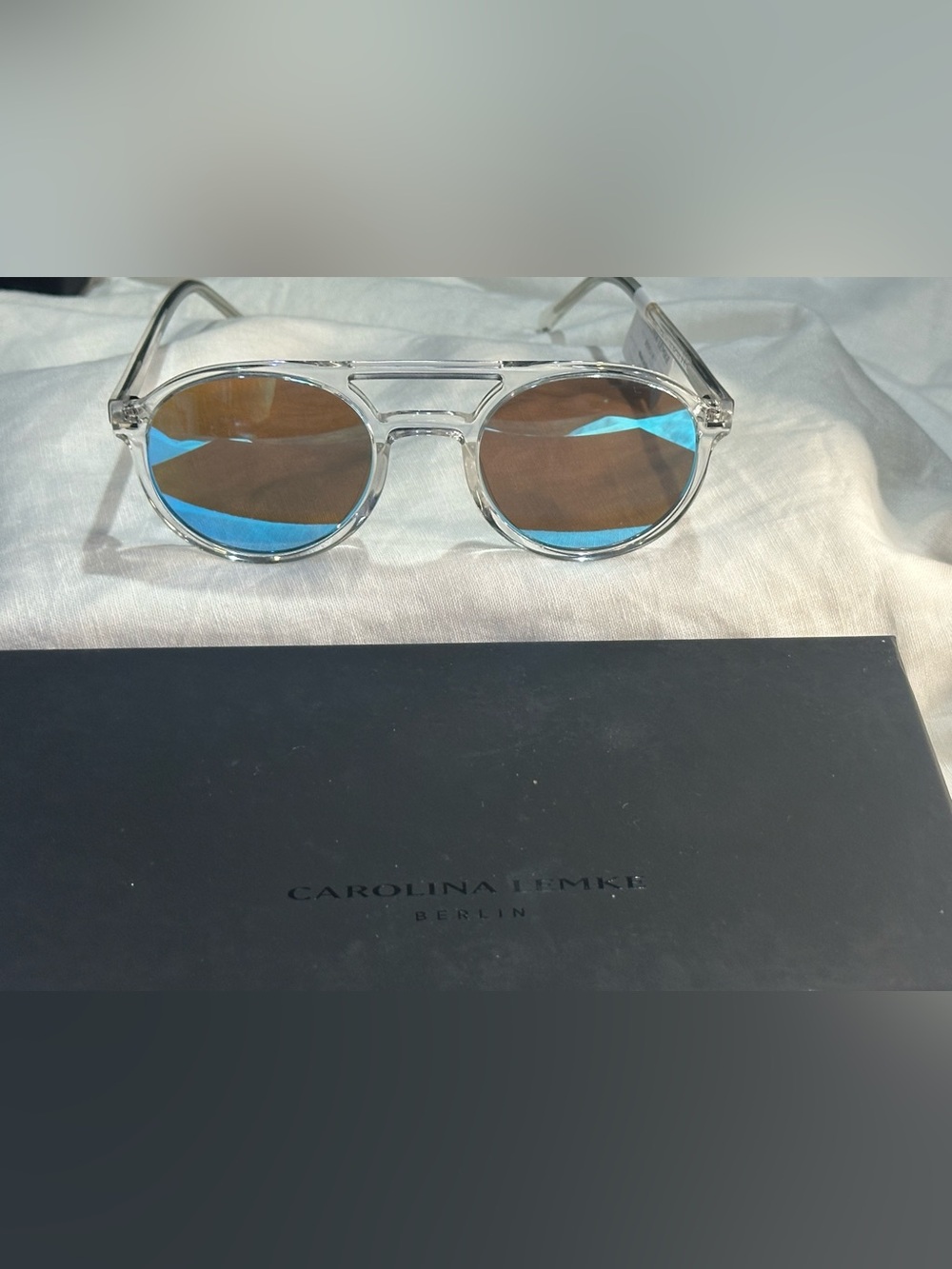 13. NEW Carolina Lemke Transparent Frame Sunglasses — Brown Lenses